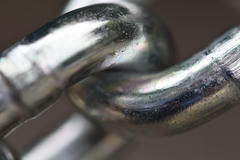 Close-up photograph of links in a chain.