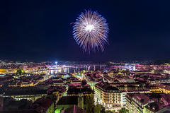 A firework exploding over Geneva skyline.